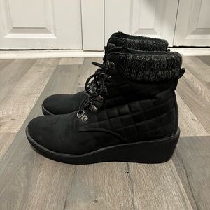 Black heeled boots. Slightly worn.